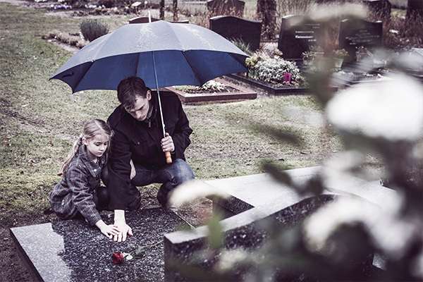 children-visiting-parents-grave