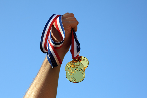 hands-holding-medals